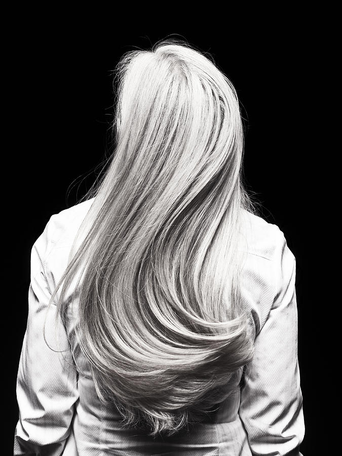 Rear view of mature womans silver head of hair Photograph by Pier
