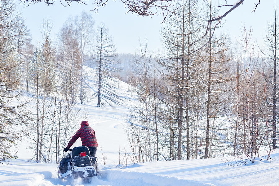 Recreational snowmobile ride in woods Photograph by CliqueImages
