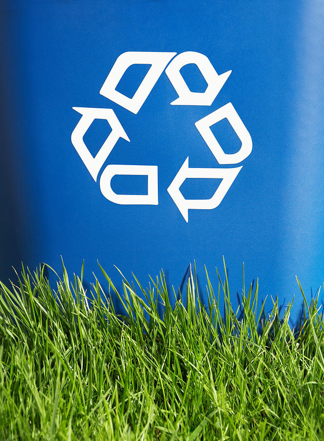 Recycling bin and grass Photograph by Image Source