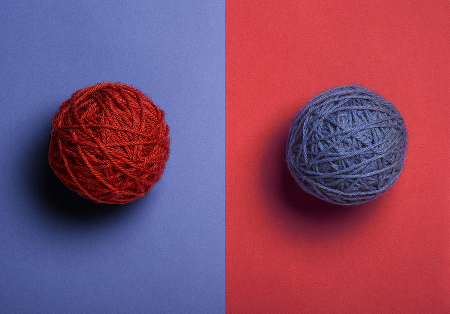 Red and Blue Balls of Yarn Photograph by Jeffrey Coolidge
