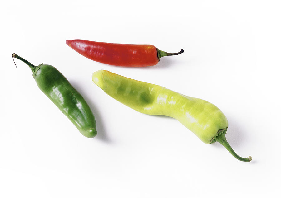 Red and green chili peppers, full length Photograph by Isabelle Rozenbaum