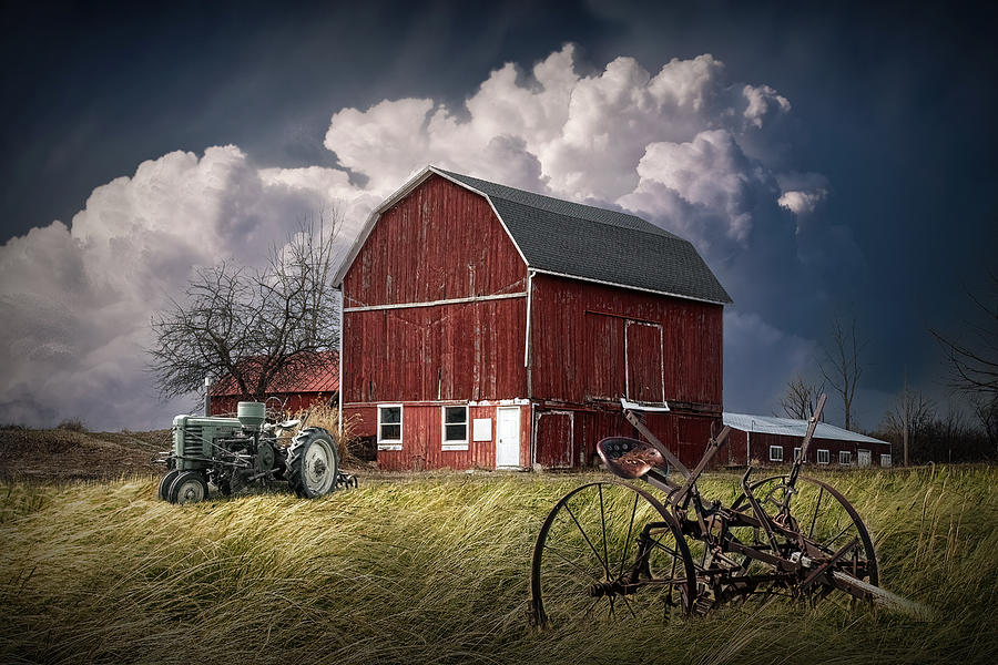 Red Barn with Green Tractor under large white cloud Photograph by ...