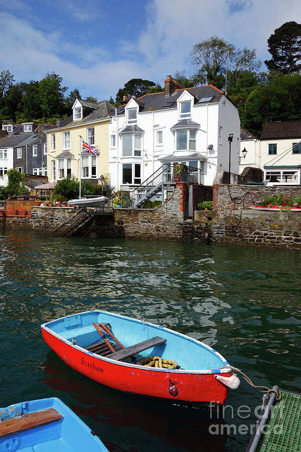 Red rowing boat on River Fowey Cornwall Photograph by James Brunker