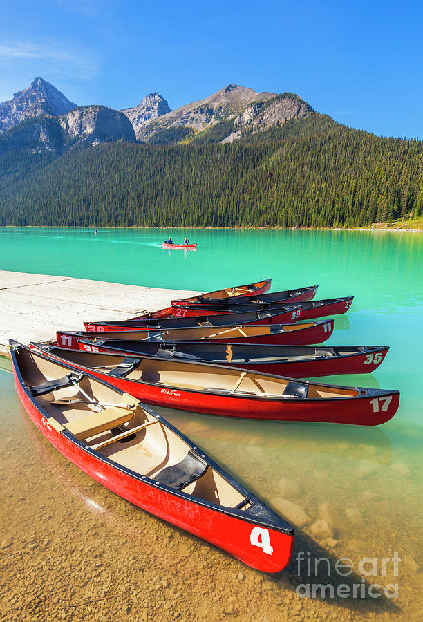 Red Canoes on Lake Louise, Banff national Park, Alberta, Canada Photograph by Neale And Judith Clark