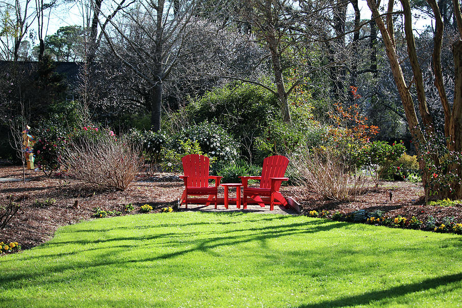 Red Chairs In The Garden Photograph by Cynthia Guinn