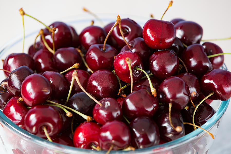 Red Cherries In Bowl Photograph by Jean-Marc PAYET