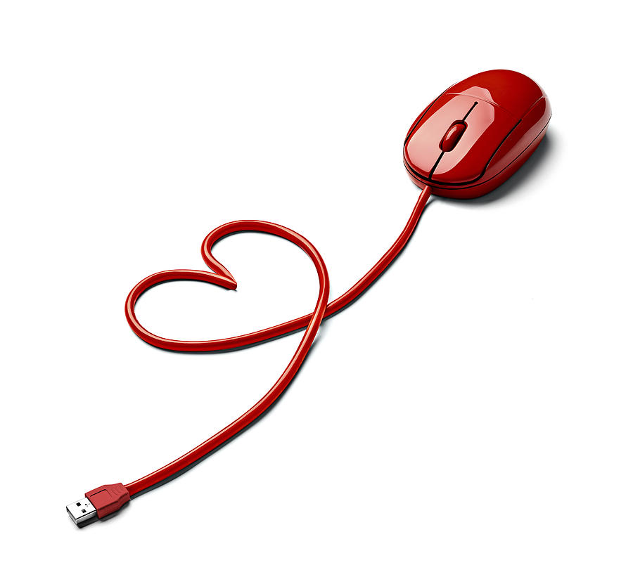 Red computer mouse and cable shaped like a heart on white ground Photograph by Westend61
