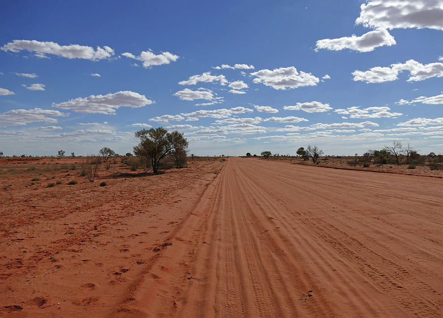 Red dirt, blue sky Photograph by Maryse Jansen