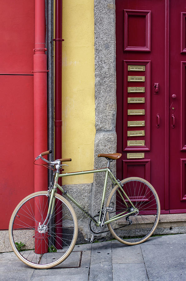 Red door and bicycle Photograph by Carlos Caetano