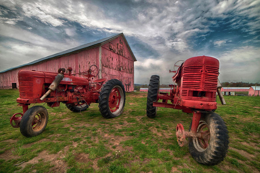 Red Farmall Tractor and Pink Barn Photograph by Joann Vitali
