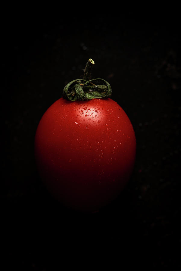 Red Fresh Healthy Tomato Isolated On A Black Pan Photograph