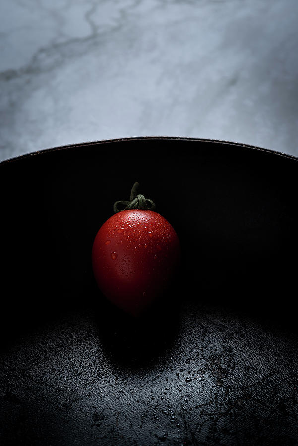 Red Fresh Healthy Tomato On A Black Pan Photograph