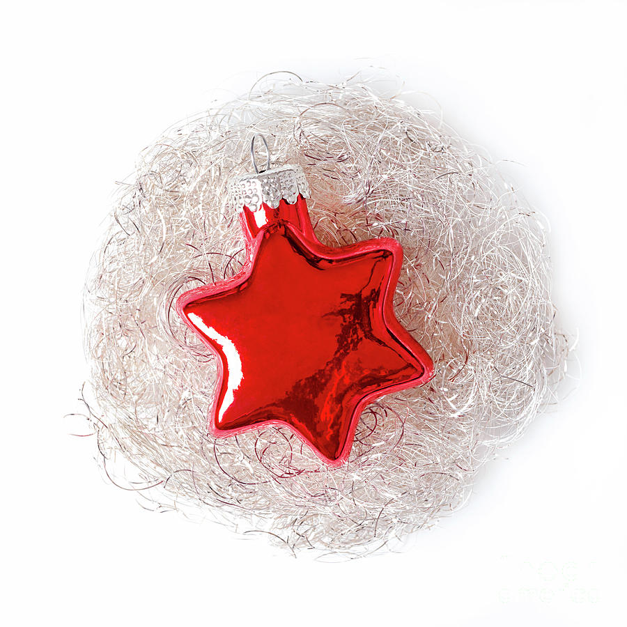 Red glass star, bedded in an angel hair nest, a Christmas