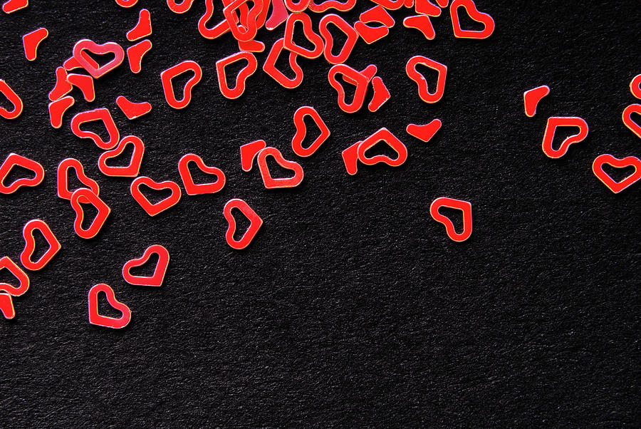 Red Heart Confetti On Black Background Photograph by Severija Kirilovaite