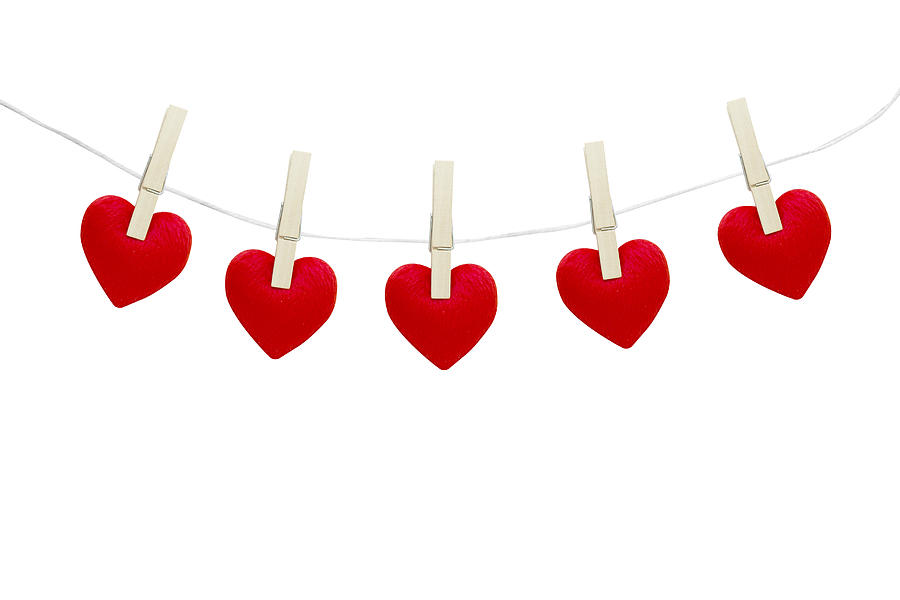Red hearts hanging on white background Photograph by Narith_2527