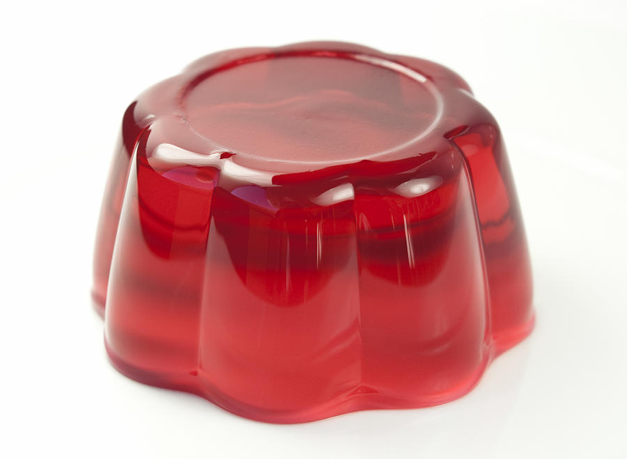 Red jelly with cherry flavor on white background Photograph by Instamatics