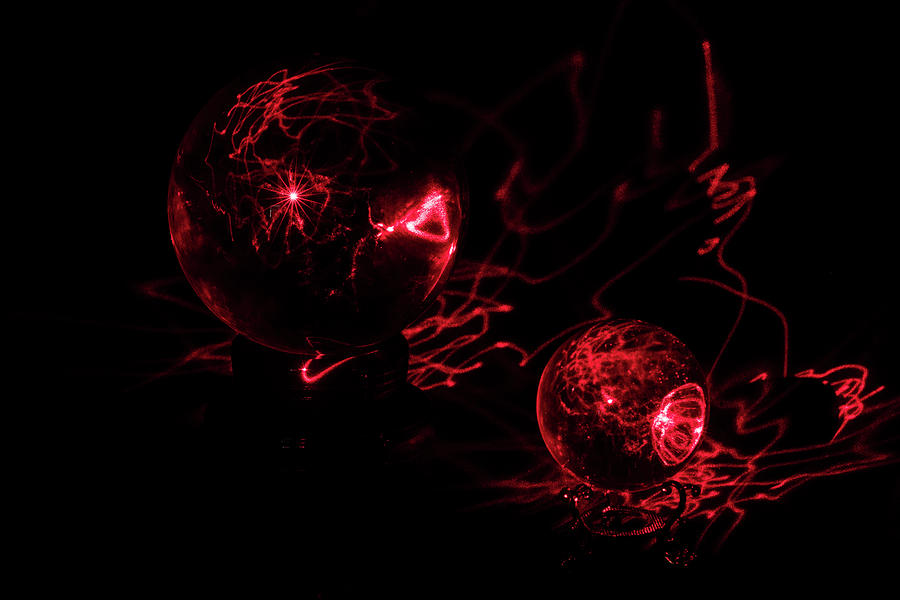 Red Laser Interacts with Two Crystal Balls Photograph by Charles Floyd