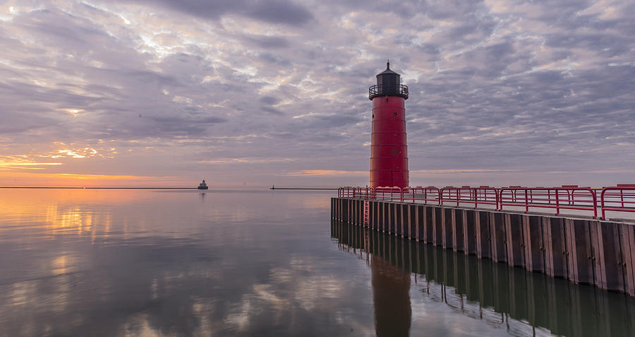 Red lighthouse on Lake Michigan at Sunrise Photograph by AMCImages