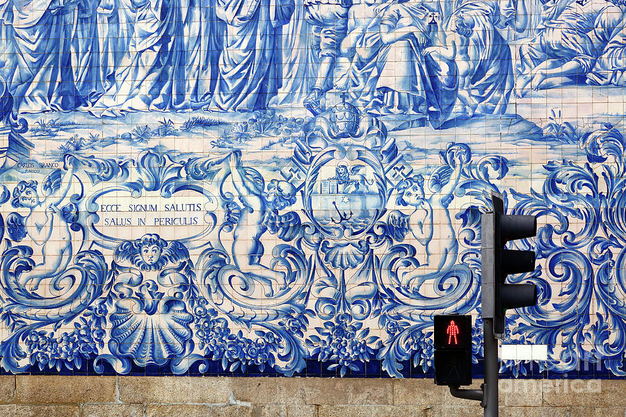 Red man and ceramic azulejos tiles Carmo church Porto Portugal Photograph by James Brunker
