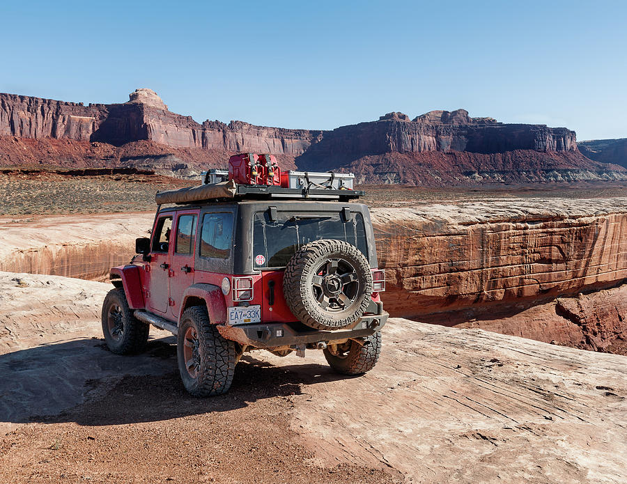 Red overland Jeep on the canyon rim 01 Photograph by Murray Rudd