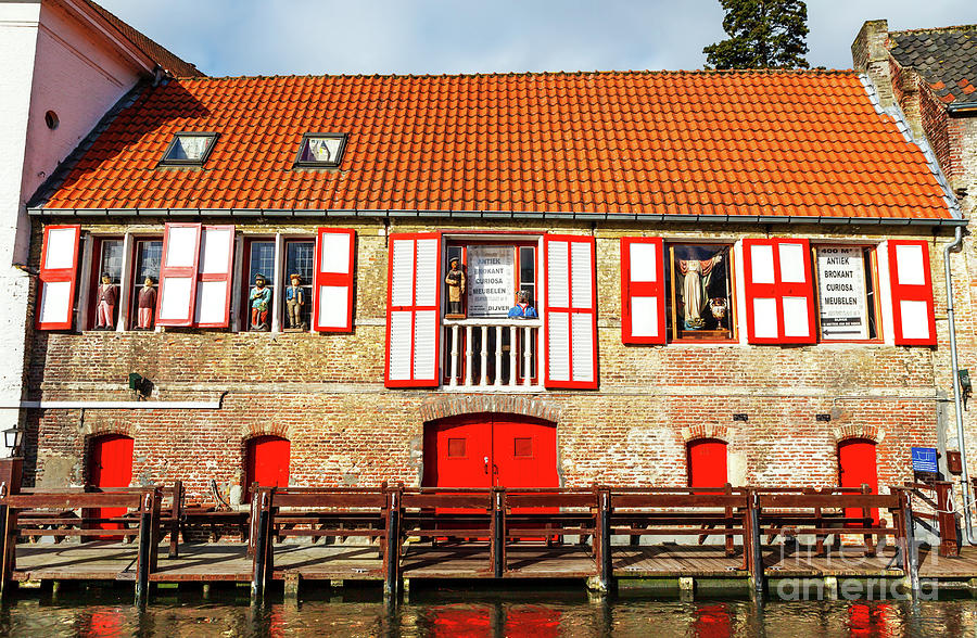 Red Reflection Along the Canal in Bruges Photograph by John Rizzuto