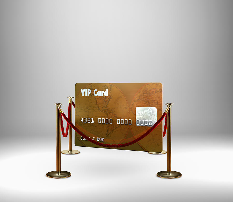 Red rope barrier around VIP credit card Photograph by Colin Anderson Productions pty ltd