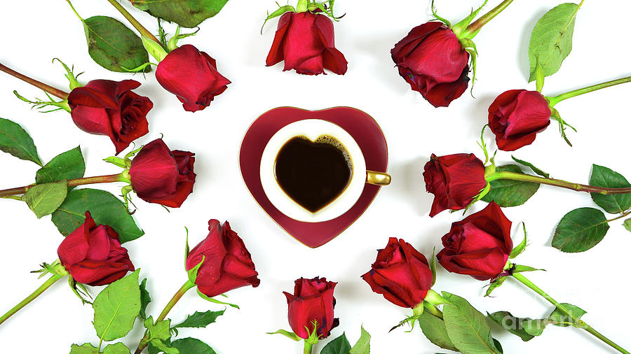 Red roses creative flat lay layout with coffee in heart shaped cup and saucer. Photograph by Milleflore Images