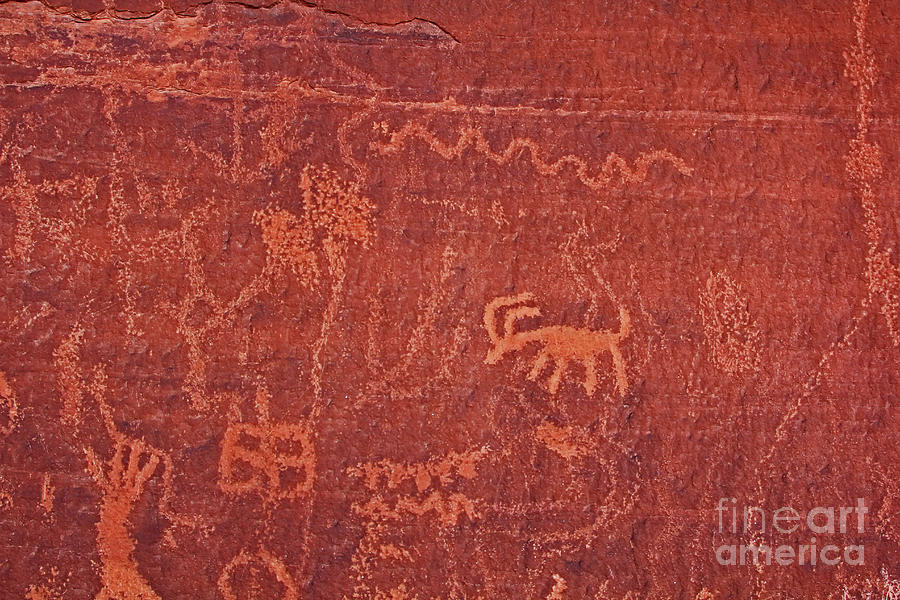 Red sandstone rock art petroglyphs  Photograph by Pete Klinger