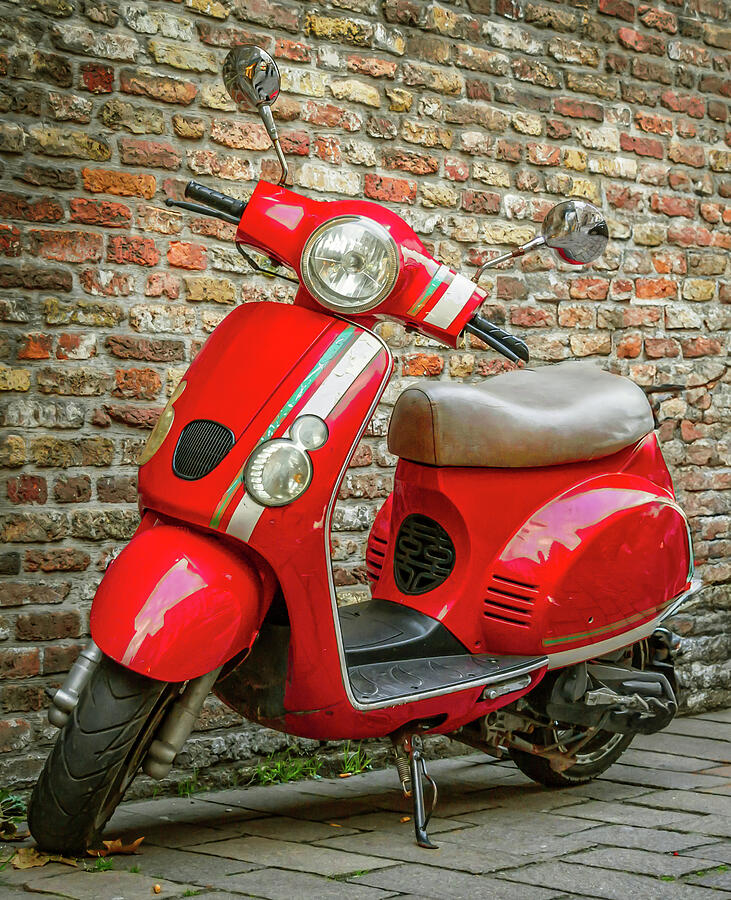 Red scooter near a vintage brick wall Photograph by Vlad Baciu