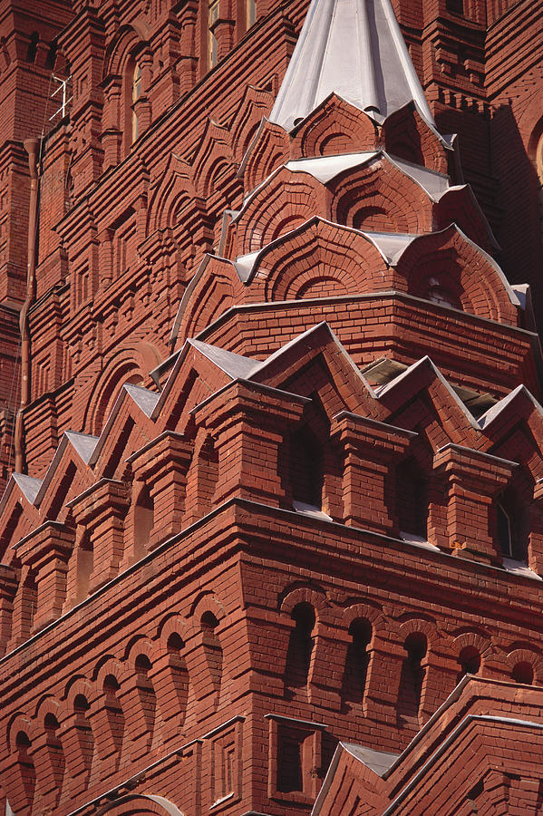 Red Stucco Is Used To Cover Intricately Designed Angles And Arches Of A Vast Building Photograph by Rubberball/Heinz Hubler