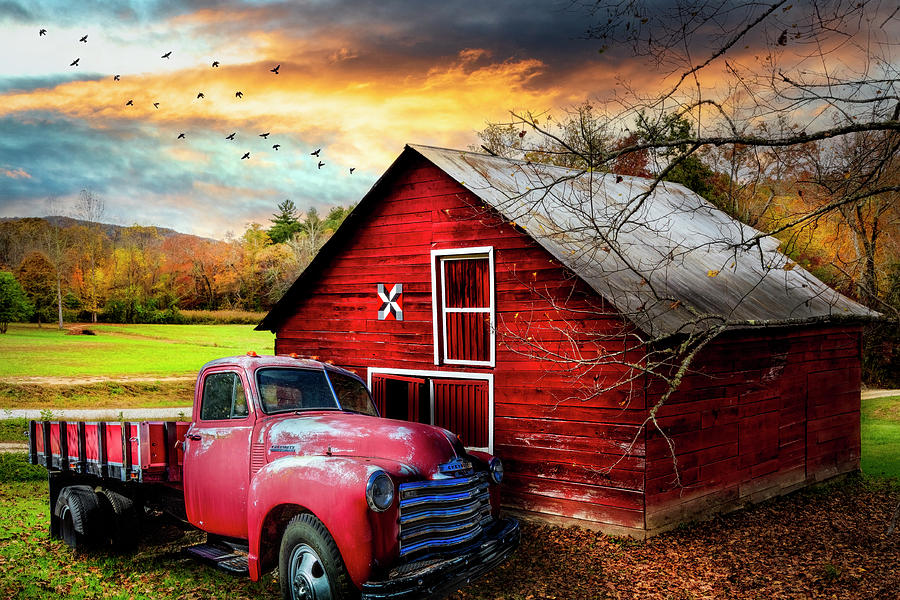 Red Truck and Red Barn under Sunset Skies Photograph by Debra and Dave Vanderlaan
