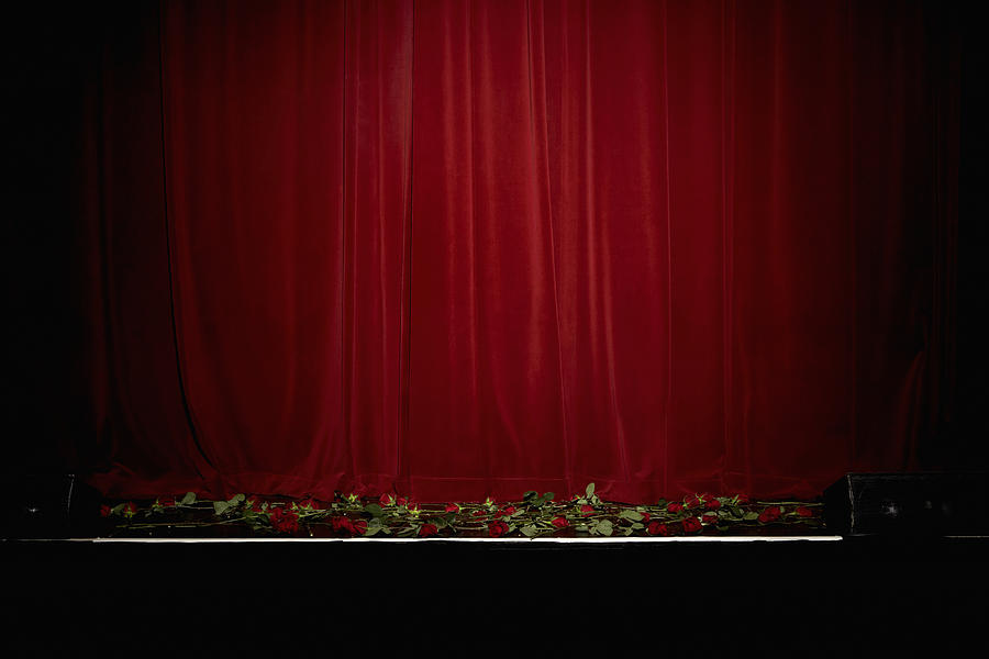 Red velvet theatre curtain, rose on stage Photograph by Leonard Mc Lane