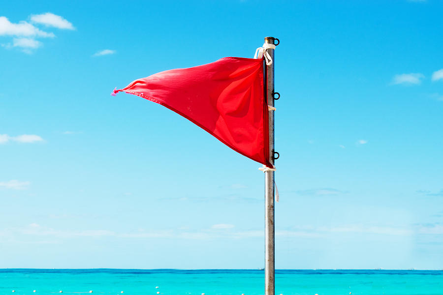 Red warning flag on the beach Photograph by Jopstock