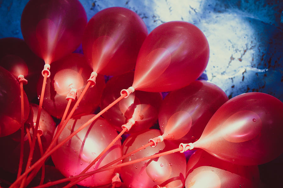 Red Water Balloons in the Sunny Pool Photograph by W Craig Photography