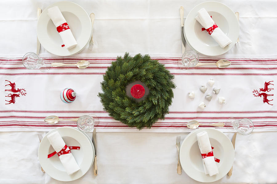 Red-white laid table with Advent wreath at Christmas time Photograph by Westend61