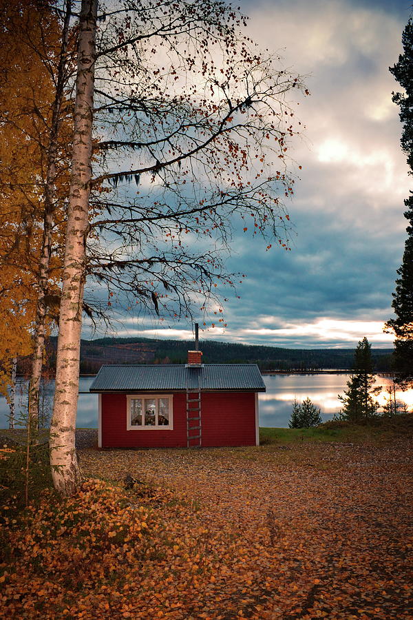 Red wooden cottage at the shore of a lake at sunset in autumn Photograph by Ulrich Kunst And Bettina Scheidulin