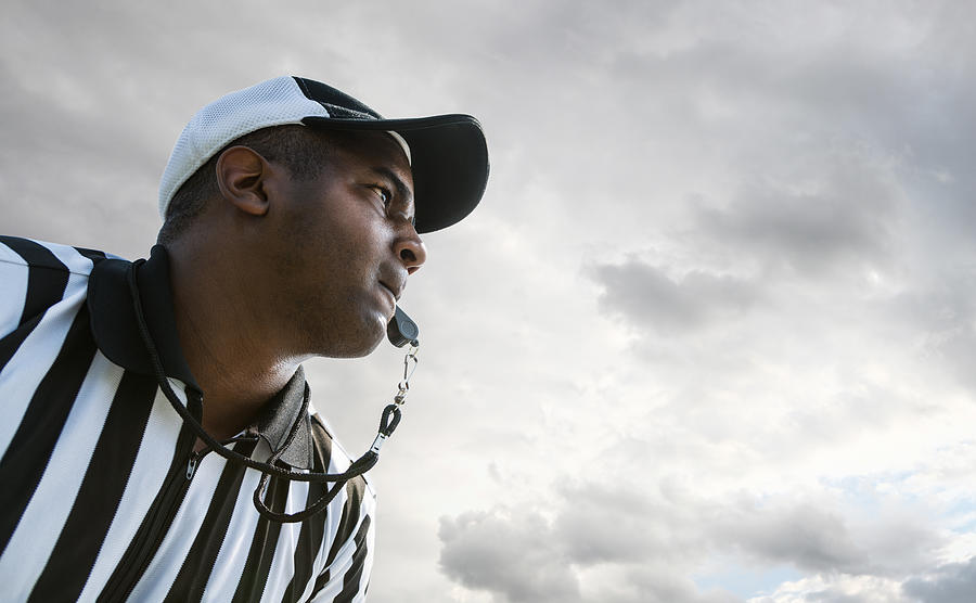 Referee Blowing Whistle During Football Game Photograph by Aiden-Franklin