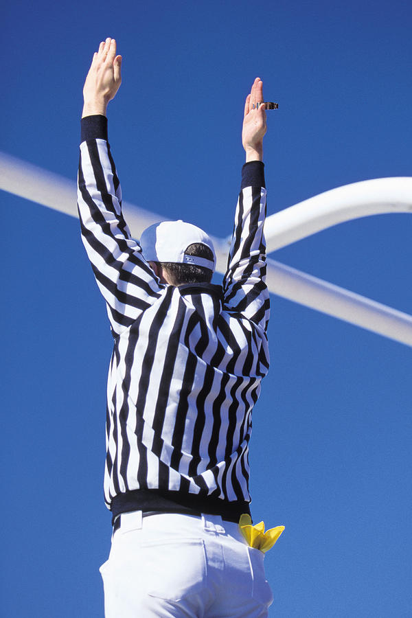 Referee signaling touchdown or successful field goal Photograph by Comstock