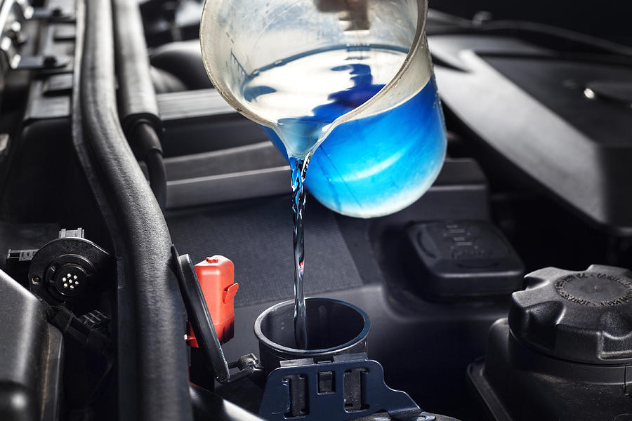 Refilling the windshield washer system antifreeze Photograph by Ollo
