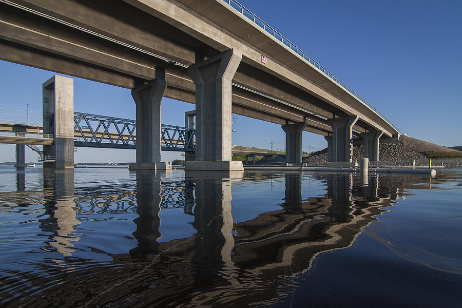 Reflecting water under the Kallavesi bridges Photograph by J-P Korpi-Vartiainen Photography