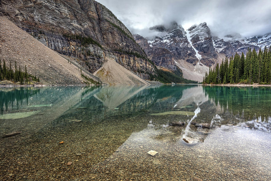 Reflection of a moody Moraine Lake Photograph by Pierre Leclerc Photography