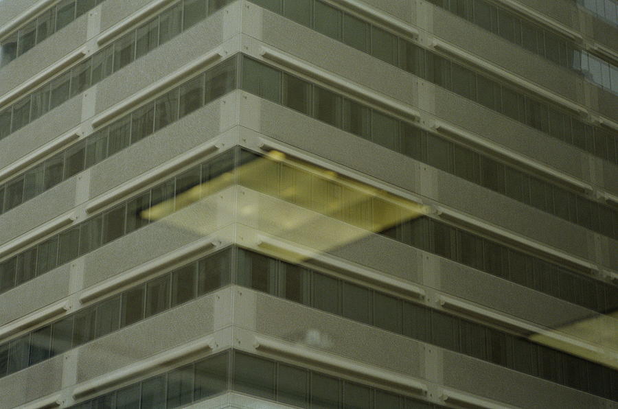 Reflection of light, fixture and office building Photograph by Reza Estakhrian