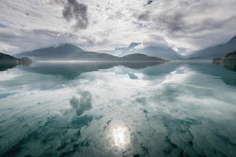 Reflection Photograph -  Reflection of mountains and clouds in a lake. by Ellis Peeters