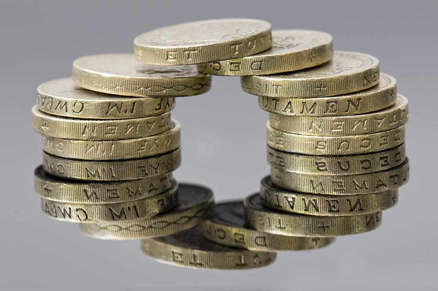Reflection of sterling pound coins making a circle Photograph by Rachel Husband