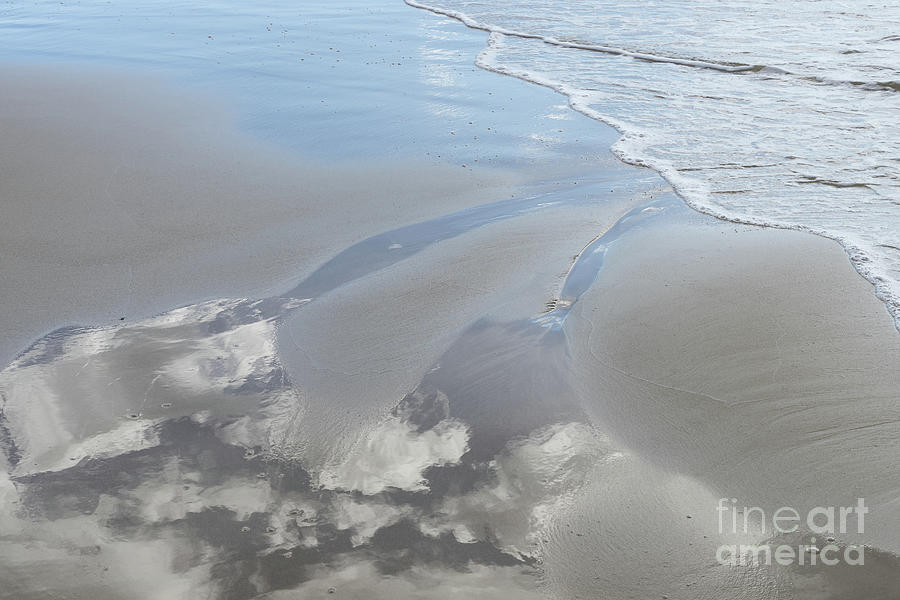 Reflection of the clouds in the wet sand Photograph by Adriana Mueller