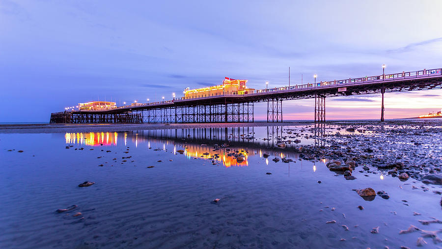 Reflection of the pier at sunset Photograph by Andrew Lalchan