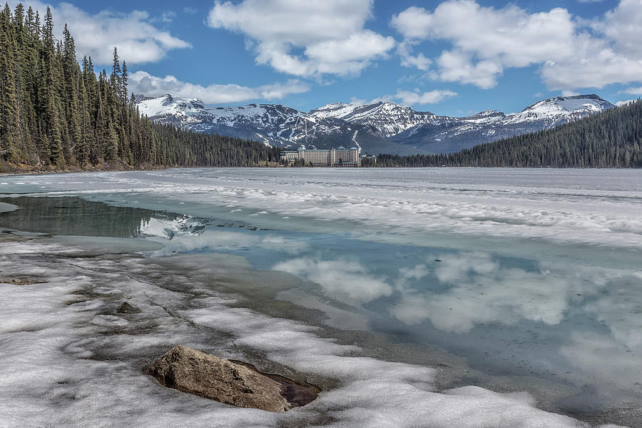 Reflections in a Partially Thawed Lake Louise Photograph by Belinda Greb