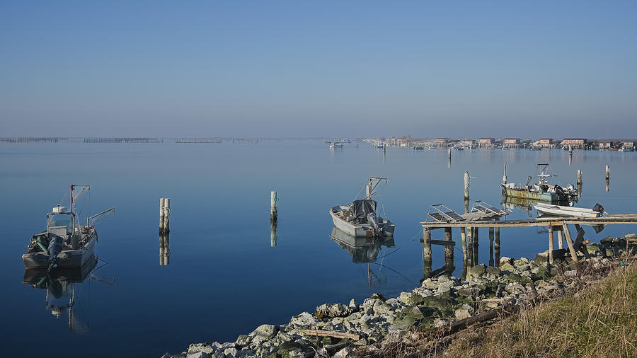 Reflections in lagoon Photograph by Loredana Gallo Migliorini