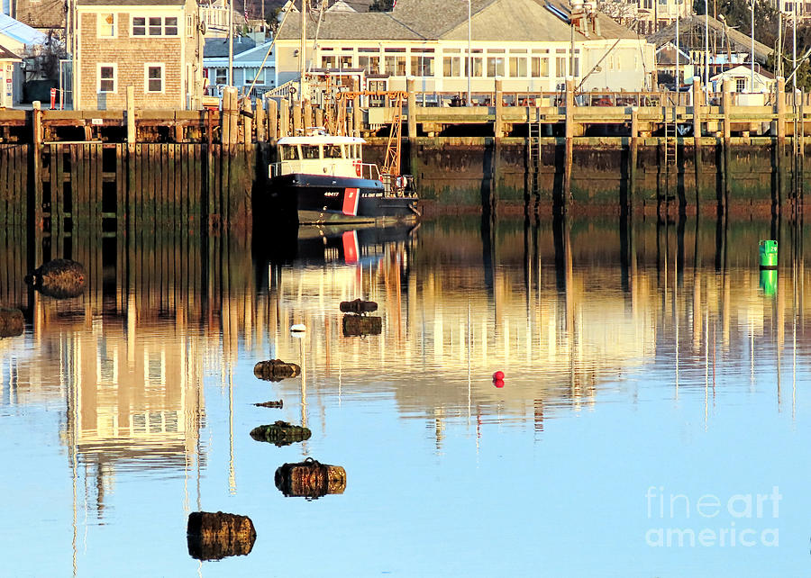 Reflections in the harbor  Photograph by Janice Drew