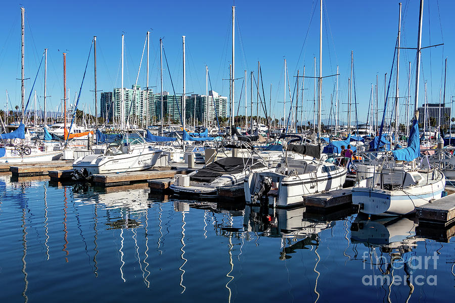 Reflections of sailboats in blue water Photograph by Roslyn Wilkins